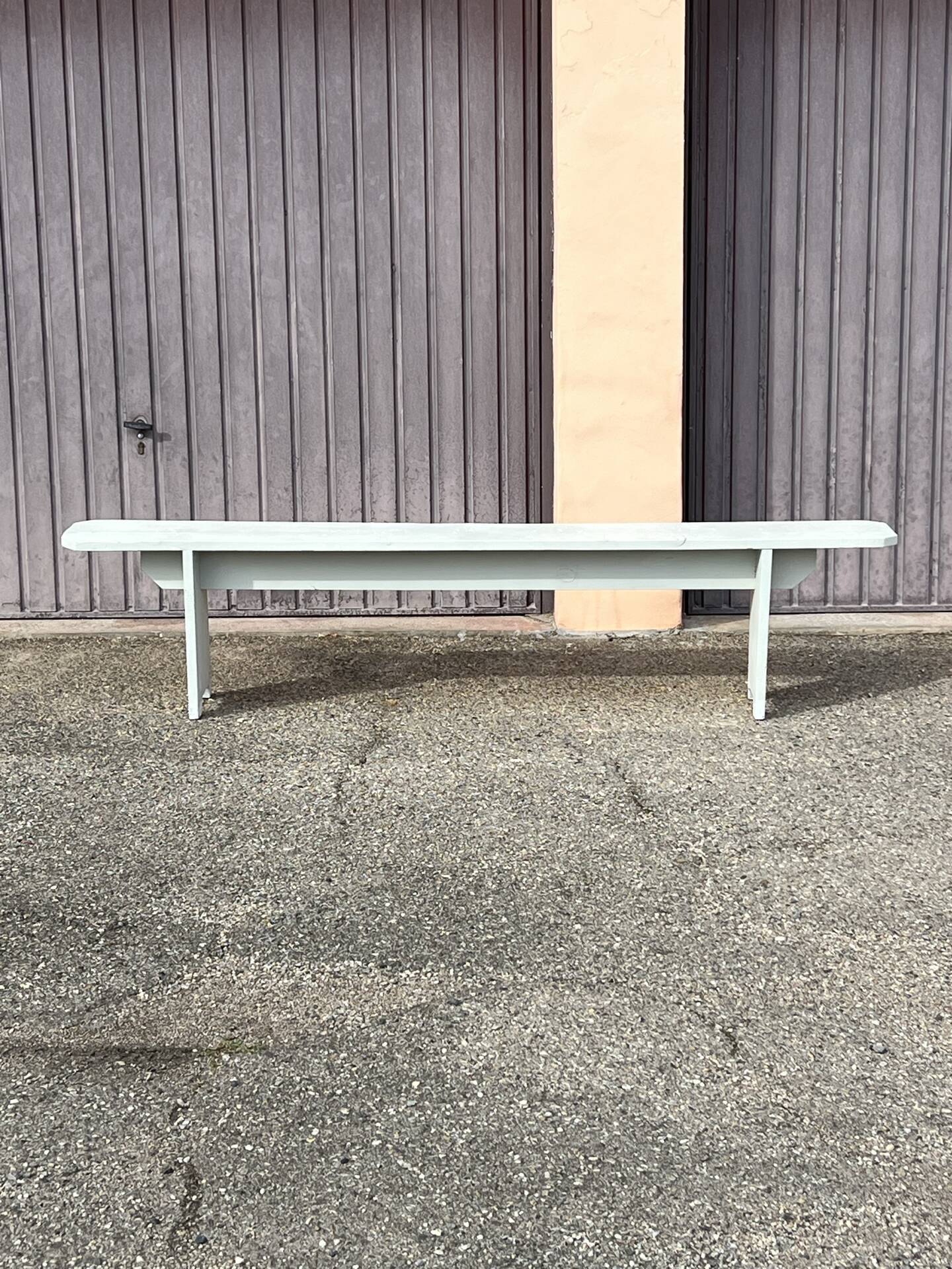 Pair of wooden benches painted white, French artisanal work.