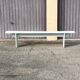 Pair of wooden benches painted white, French artisanal work.