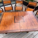 Rectangular dining table set and its suite of 6 armchairs in exotic wood and bamboo.