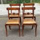 4 Regency chairs in solid wood and brown-beige leather from the 19th century.