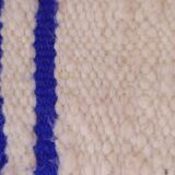 Coussin rayé bleu et blanc en laine