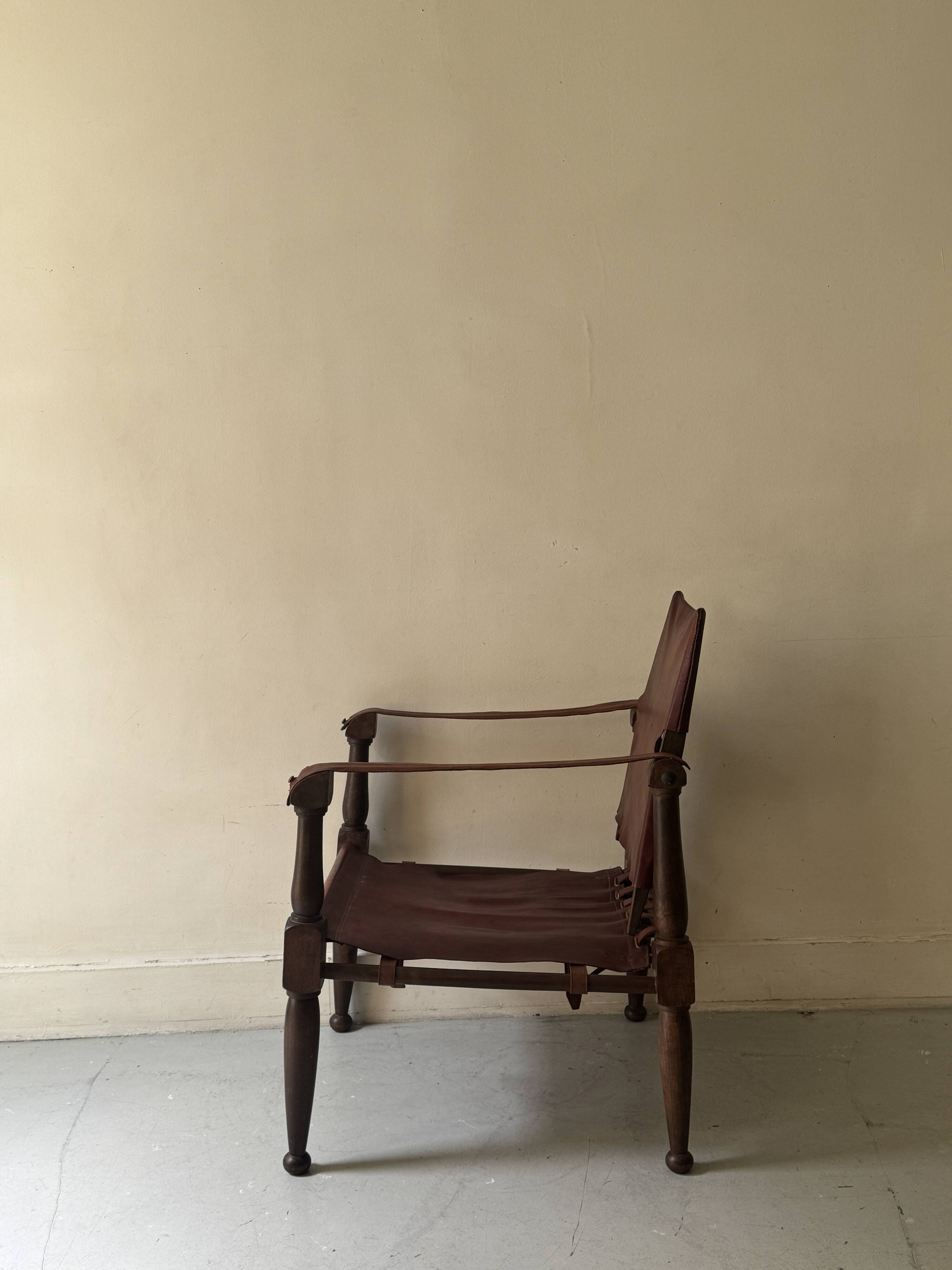 Scandinavian safari armchair in wood & burgundy leather upholstery 20th century