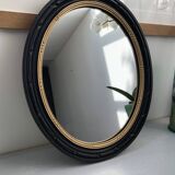 black and gold oval mirror
