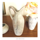 2 jugs in rough cut stone