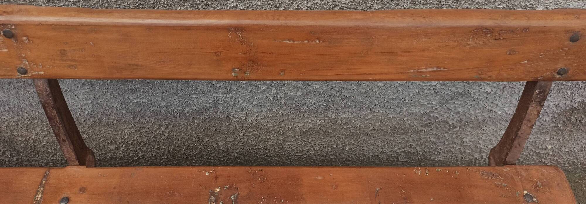 Old wooden bench with cast iron base
