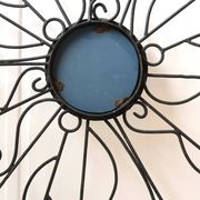 Grand miroir soleil en métal noir, années 70