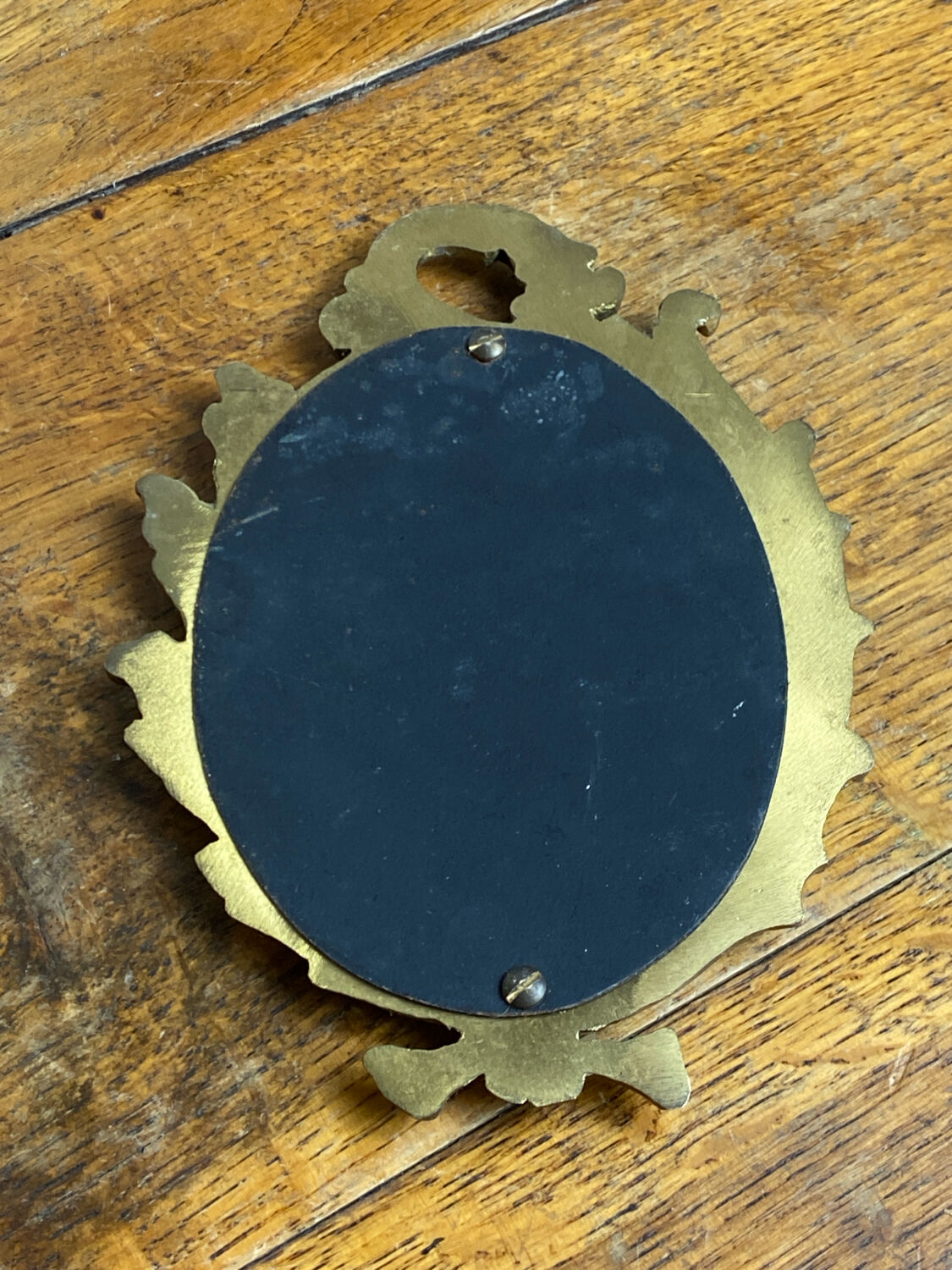 Small antique bronze mirror
