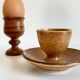 Trio of vintage ceramic and wood egg cups
