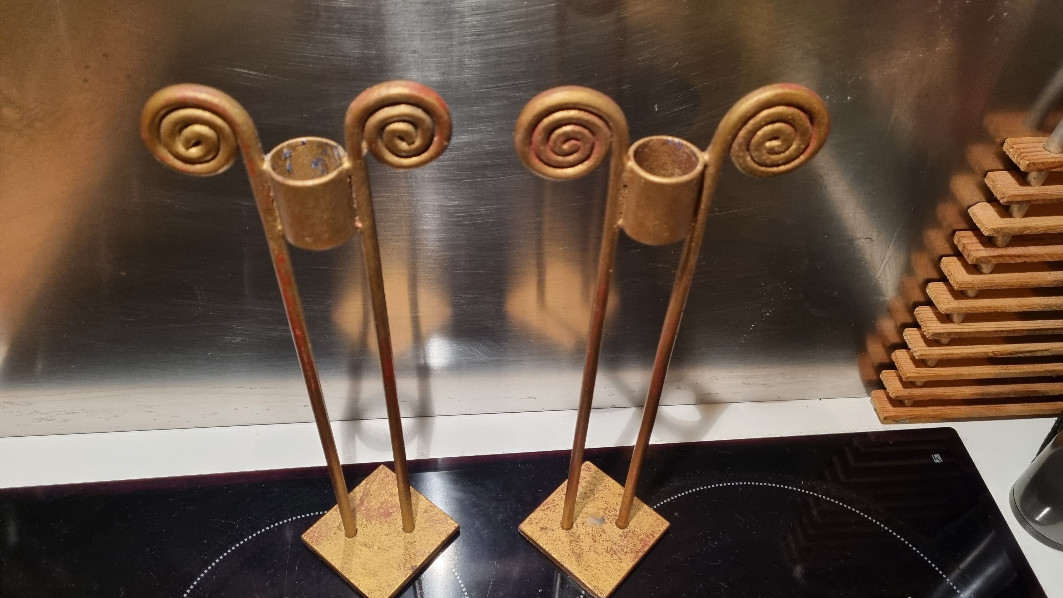2 golden metal candlesticks