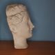 Antique plaster face of a woman