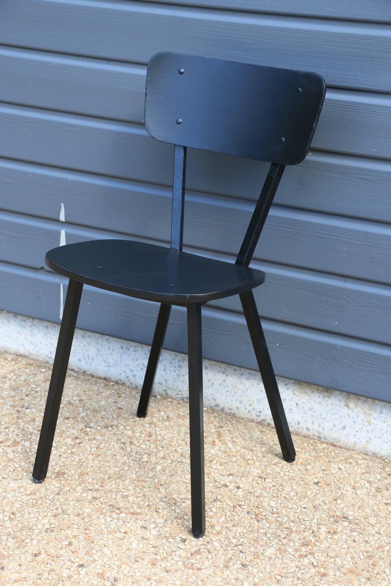 4 black metal and wood chairs