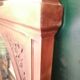 Old oval walnut wood mirror has flower carvings decoration