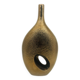 Golden ceramic vase.