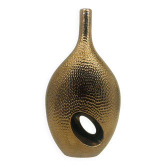 Vase en céramique doré.