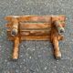 Rustic stool in solid wood with turned legs.