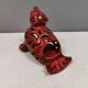 Beautiful seal in ceramic with metallic red glaze.