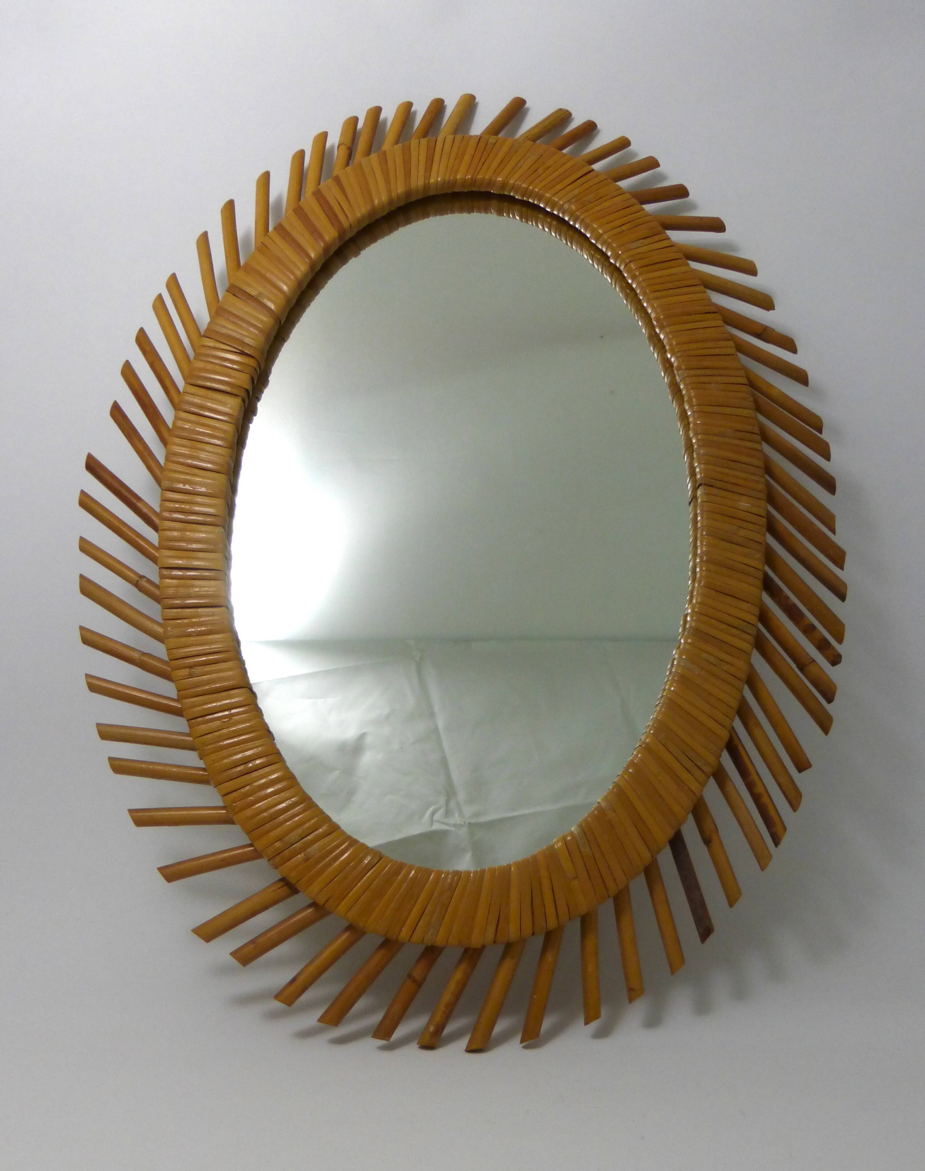 Mirror rattan oval radiating around 1960  - 37x50cm