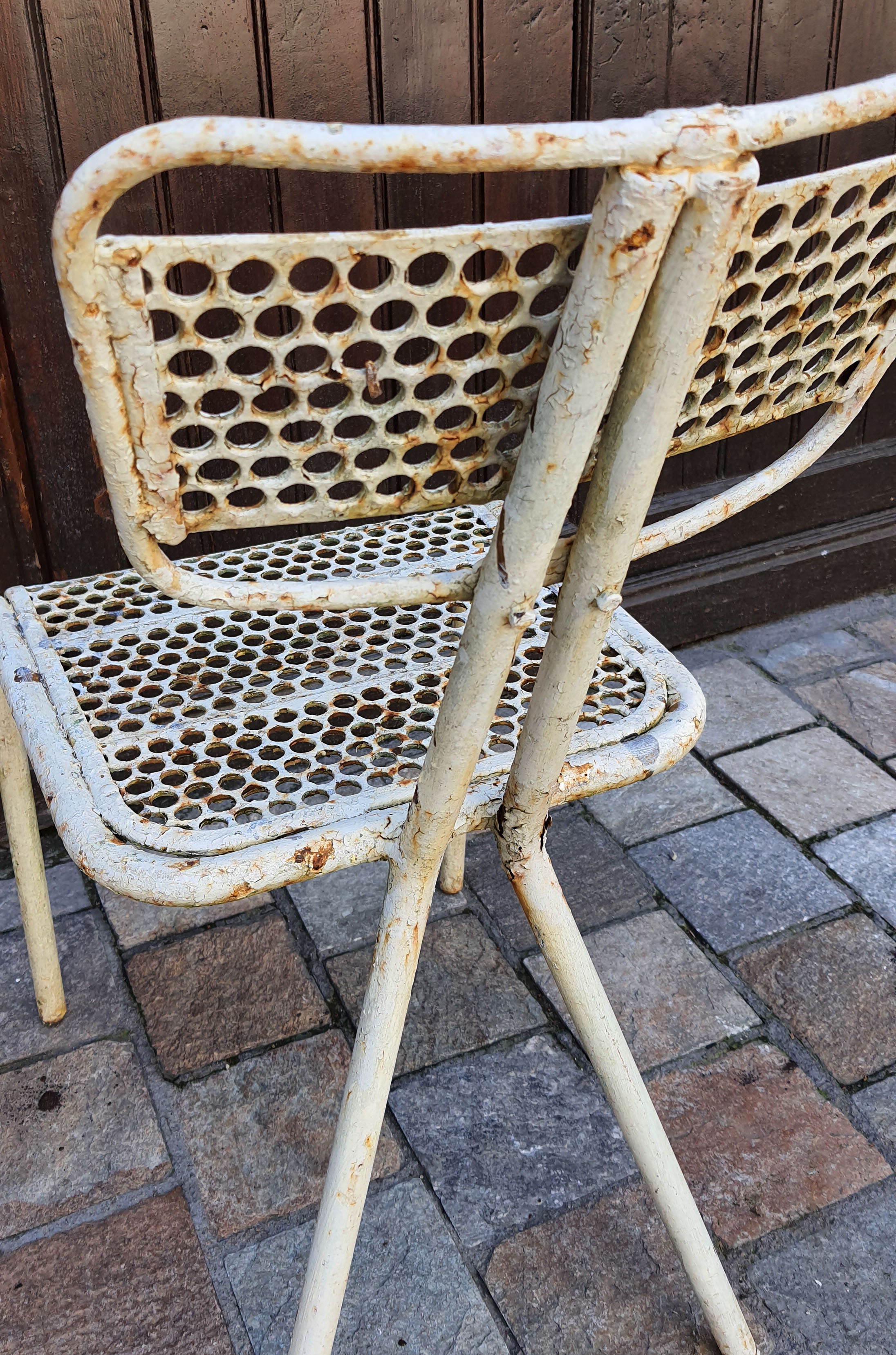Perforated metal chairs René Malaval 1950