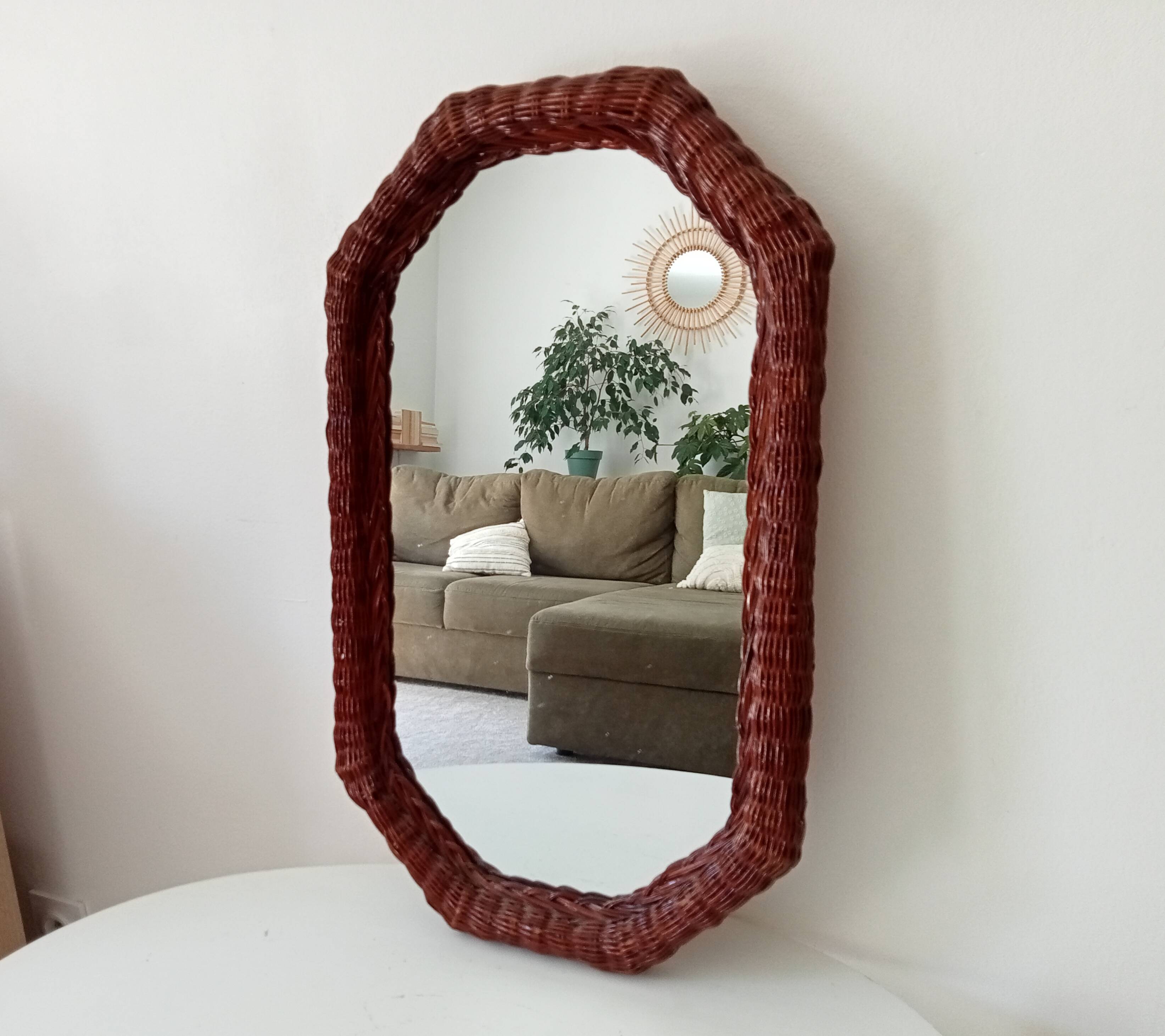 Vintage octagonal mirror in woven rattan.