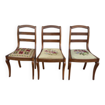 Set of three Louis XV chairs in solid walnut with petit point upholstery from the 19th century.