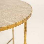Golden metal side table with a grey marble top, 20th century.