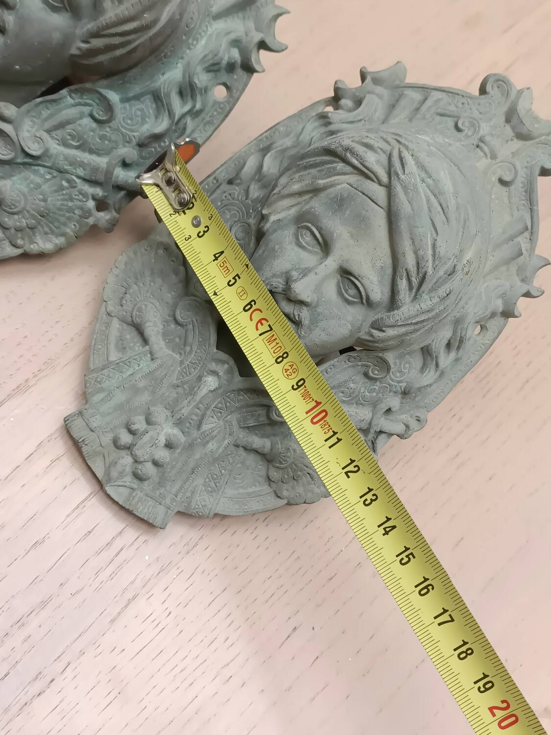 Bronze door knockers and billiard table corners