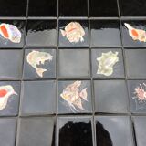 Vintage ceramic coffee table by Guy Trévoux with wrought iron base.