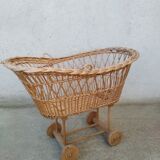 Rattan cradle for doll on vintage wheels