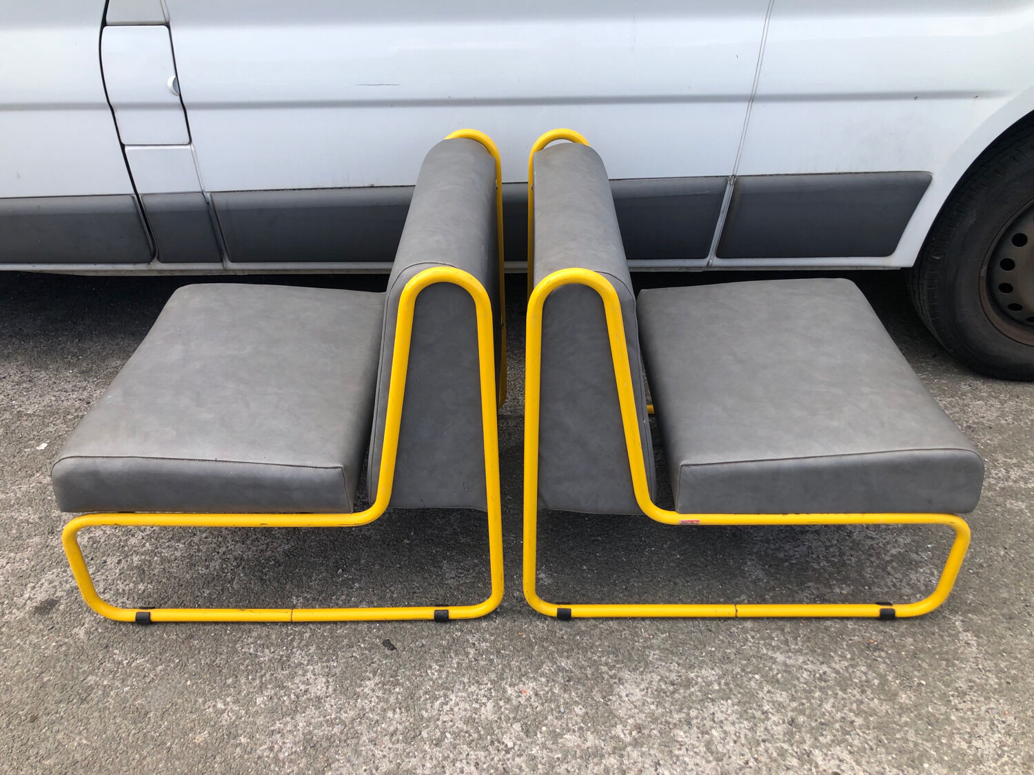 Pair of designer armchairs by Henri Julien