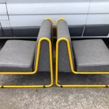 Pair of designer armchairs by Henri Julien