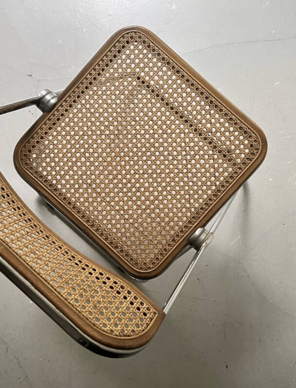 Plia folding chair in chrome and cane by Giancarlo Piretti, design 1970.