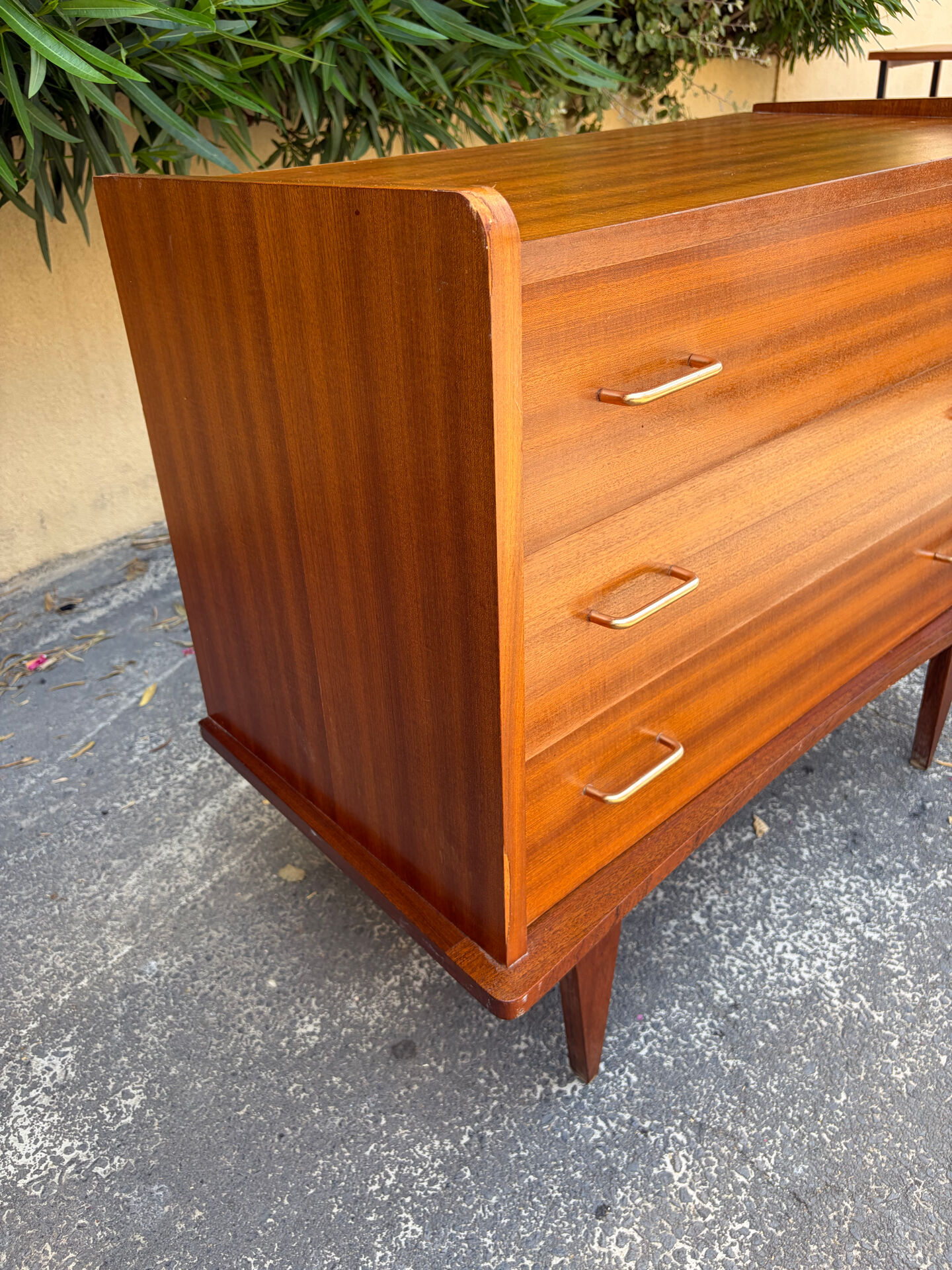 Vintage 1950s small chest of drawers with compass legs.