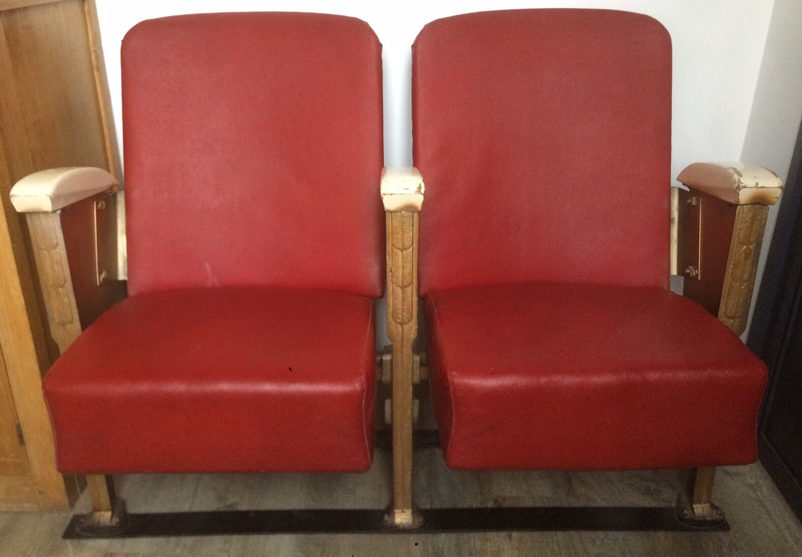 Pair of red skai leather cinema chairs