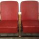 Pair of red skai leather cinema chairs