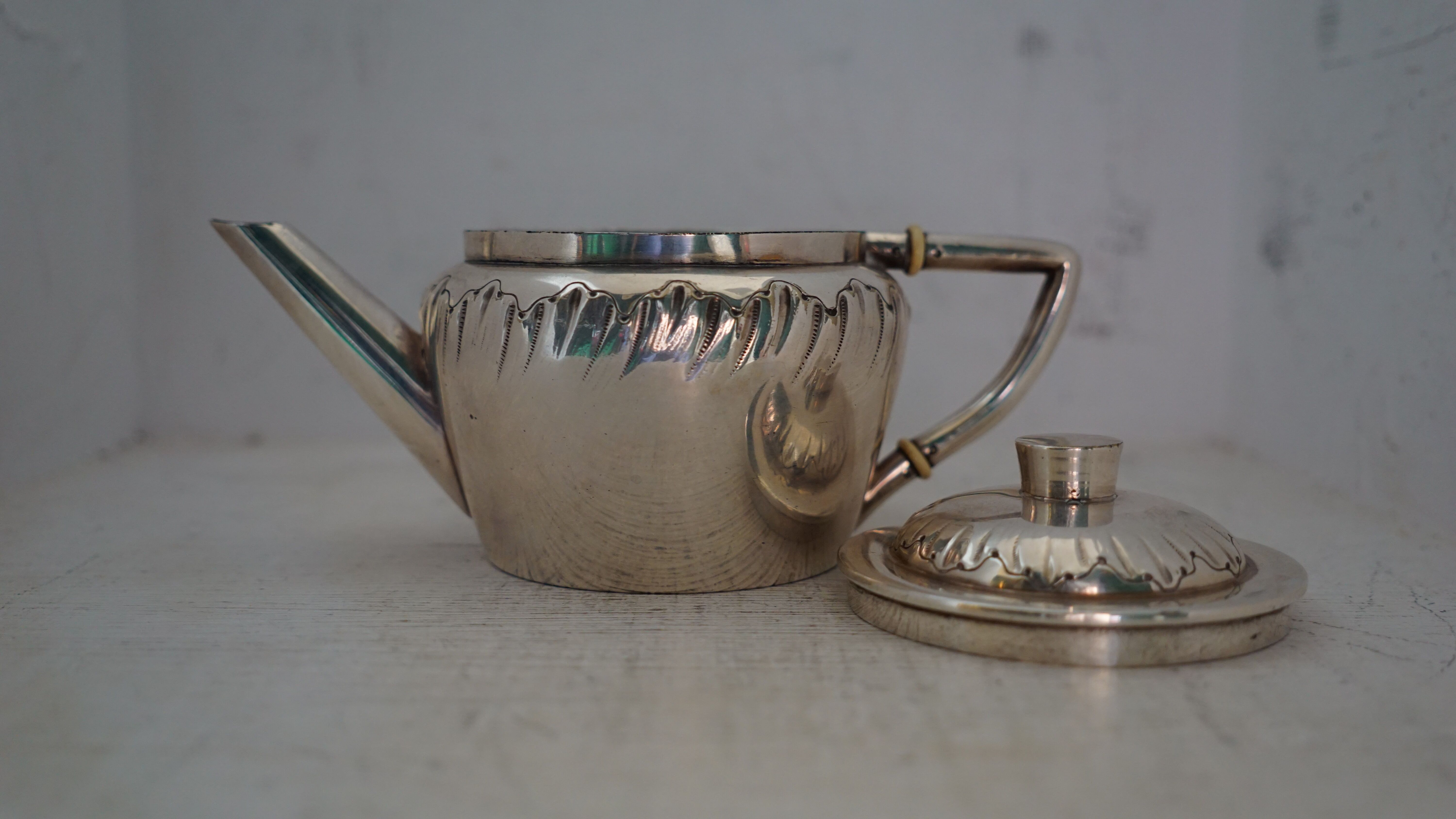 Teapot and milk jug English silverware