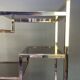 Italian shelf in gold-plated metal and smoked glass