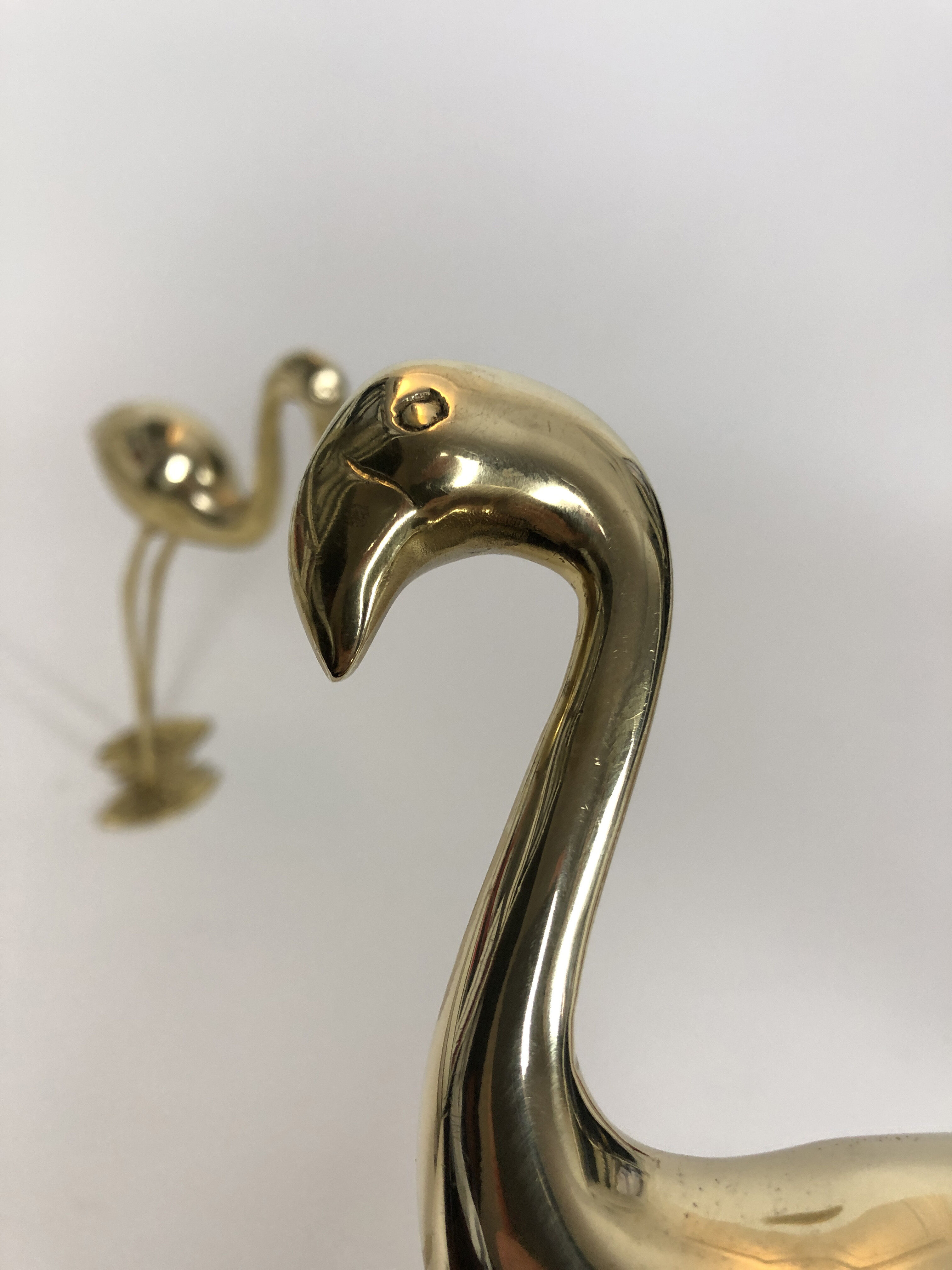 Pair of cranes or Hollywood regency herons in golden brass from the 70