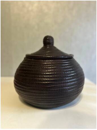 Dark purple wicker and leather round basket