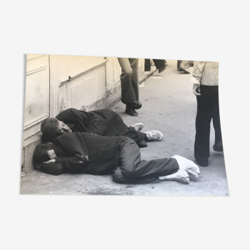 Photography 90s, two men lying in the street
