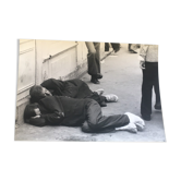 Photography 90s, two men lying in the street