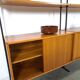 Modulair Omnia wandsysteem, Hilker, teak en zwart staal met legplanken