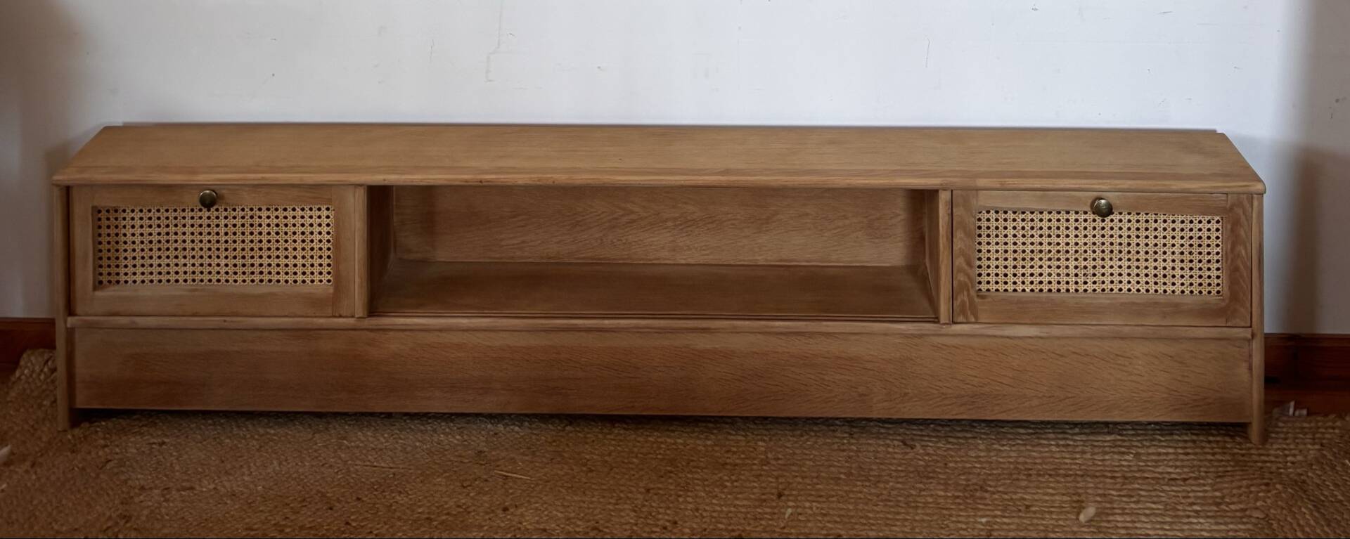TV sideboard in raw oak and cane.