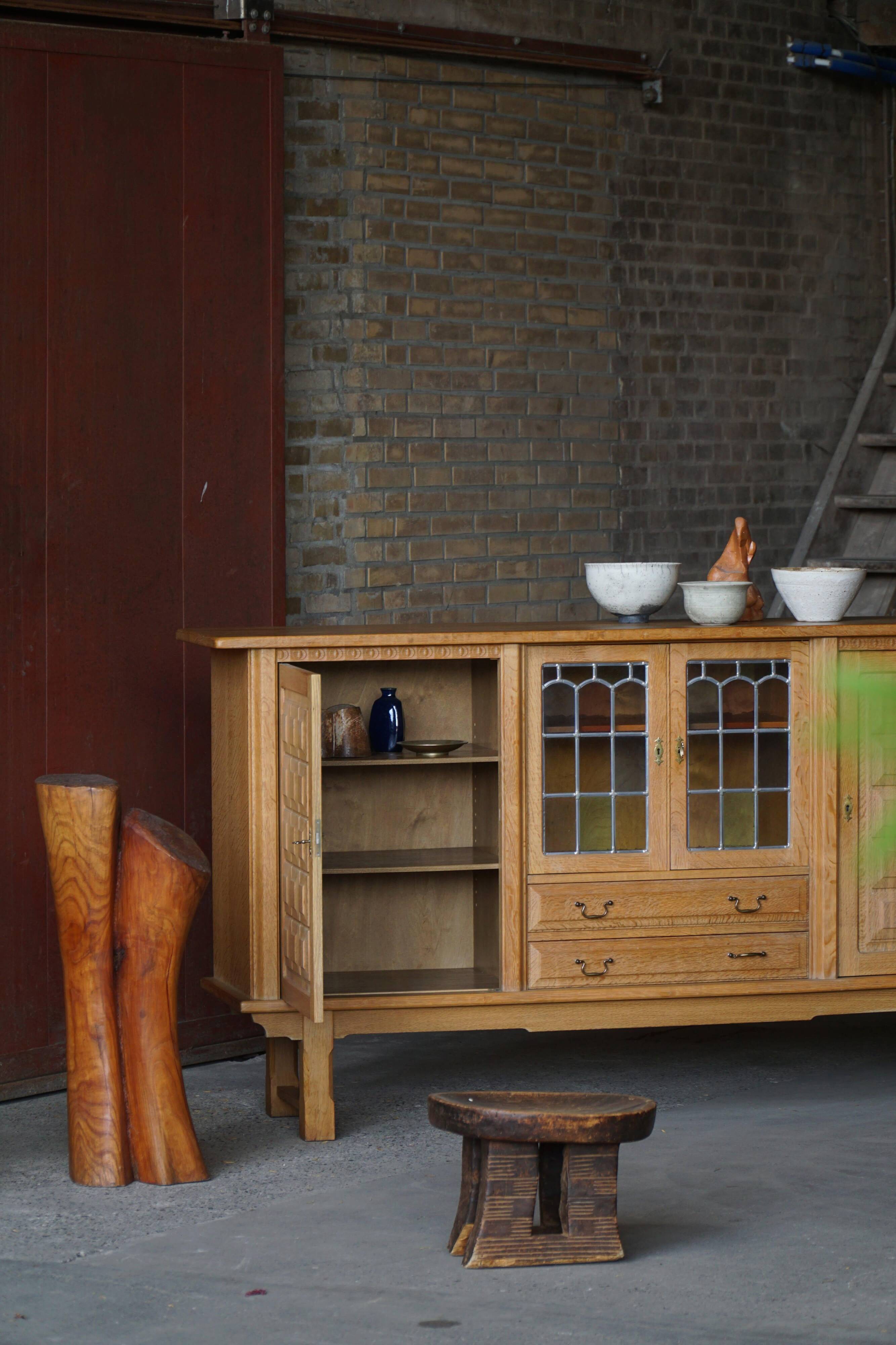 Danish oak buffet with lead glass doors, Henning Kjærnulf, Denmark, 1960s