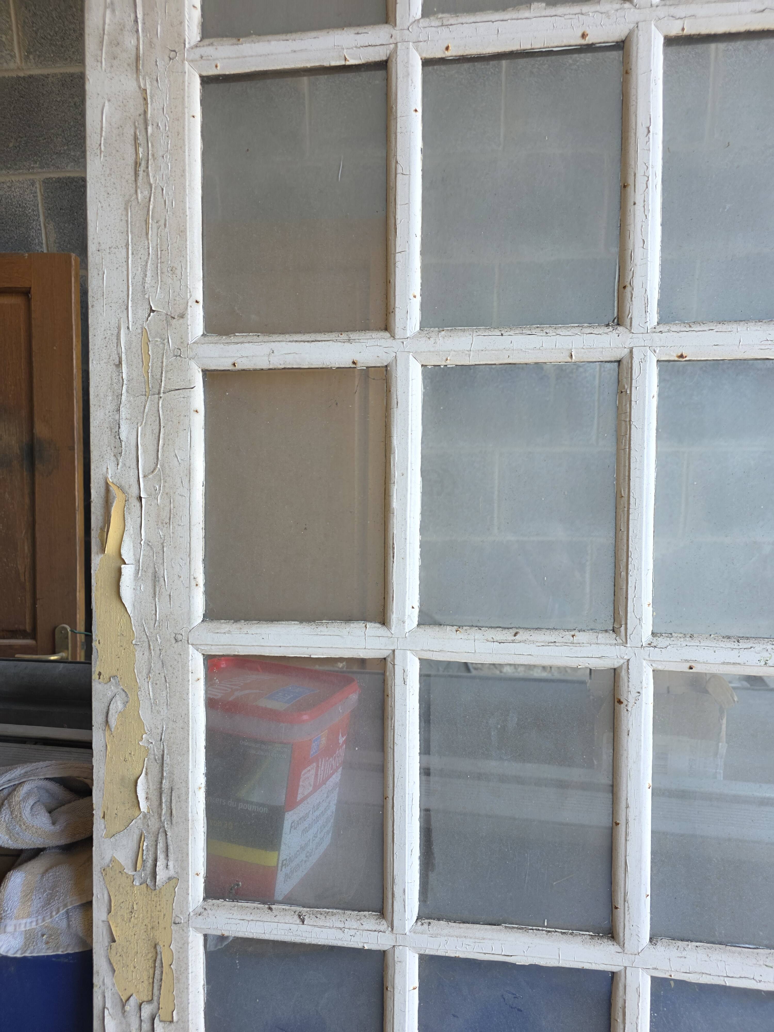 Two pairs of solid oak doors with small panes.