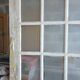 Two pairs of solid oak doors with small panes.