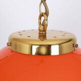 Orange glass pendant light by Peill Putzler, Germany, 1970.