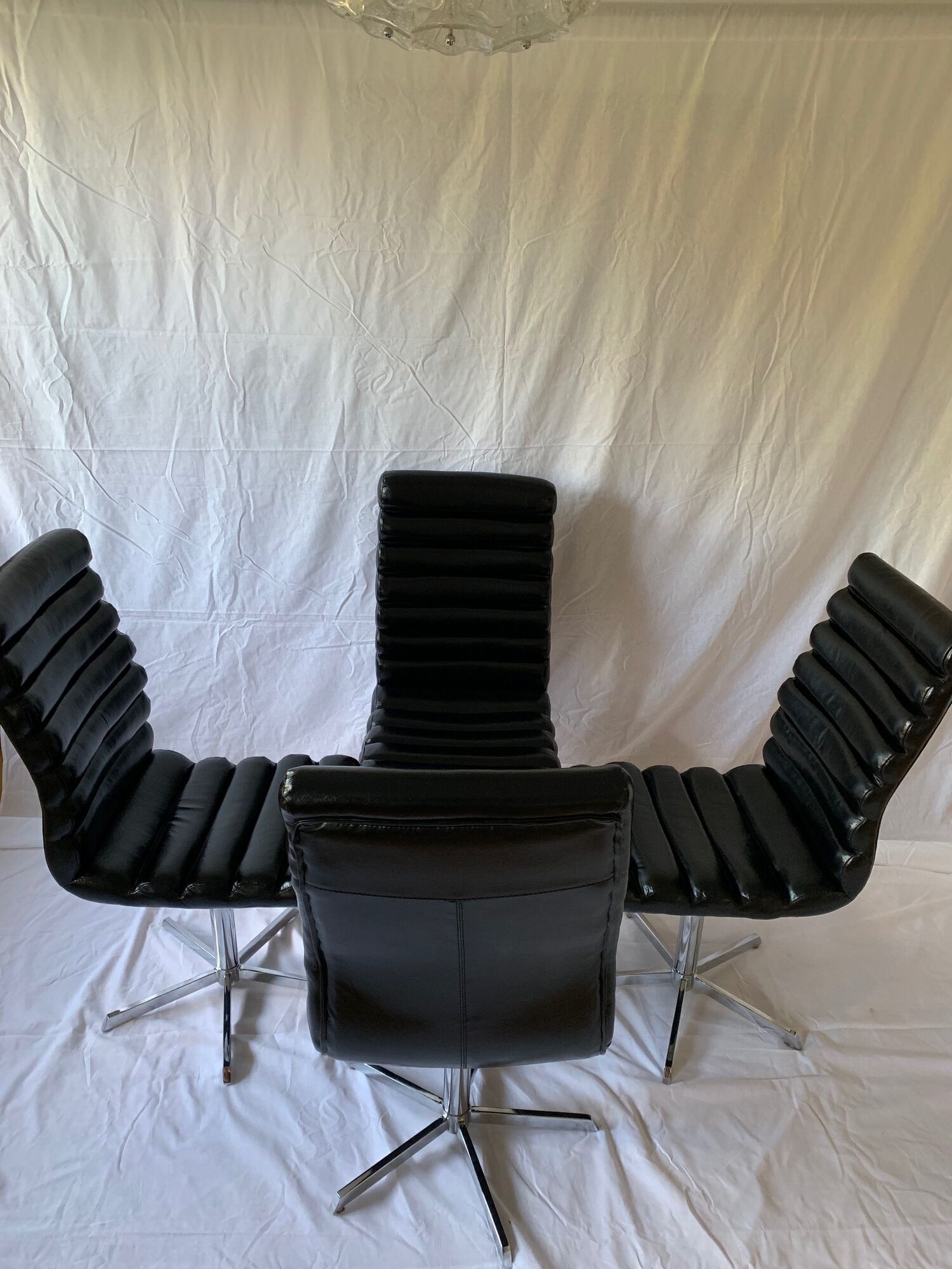 A set of four leather chairs, Italy, 80s