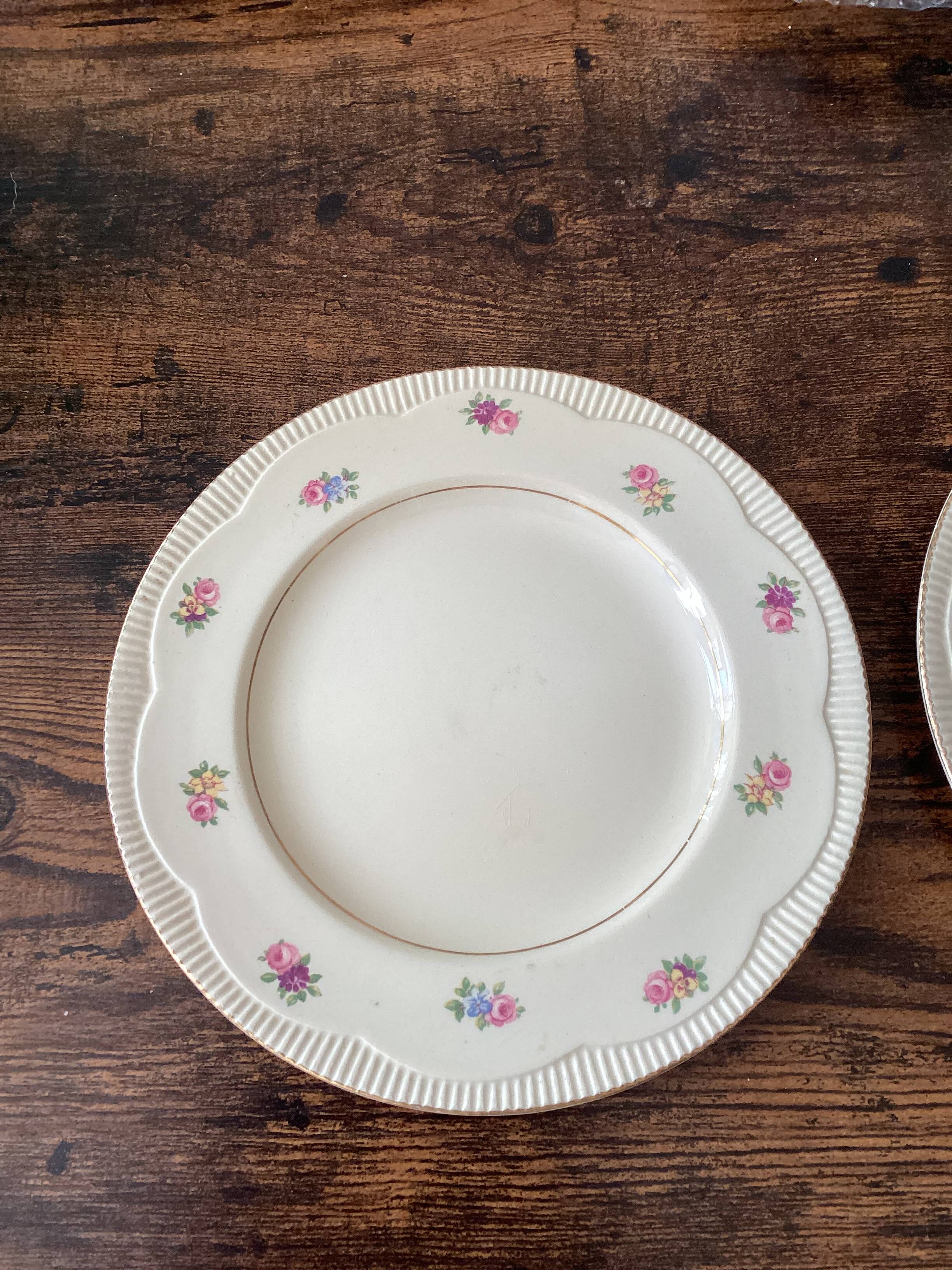 Two identical vintage Clarice Cliff plates from the Newport Pottery.