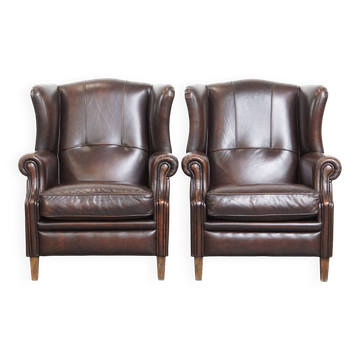 Comfortable and very beautiful set of 2 cow leather wingback armchairs in English style