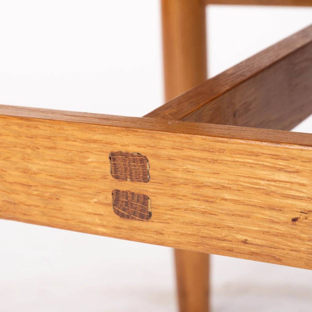 Oak chair with a black leather seat made in the 1960s